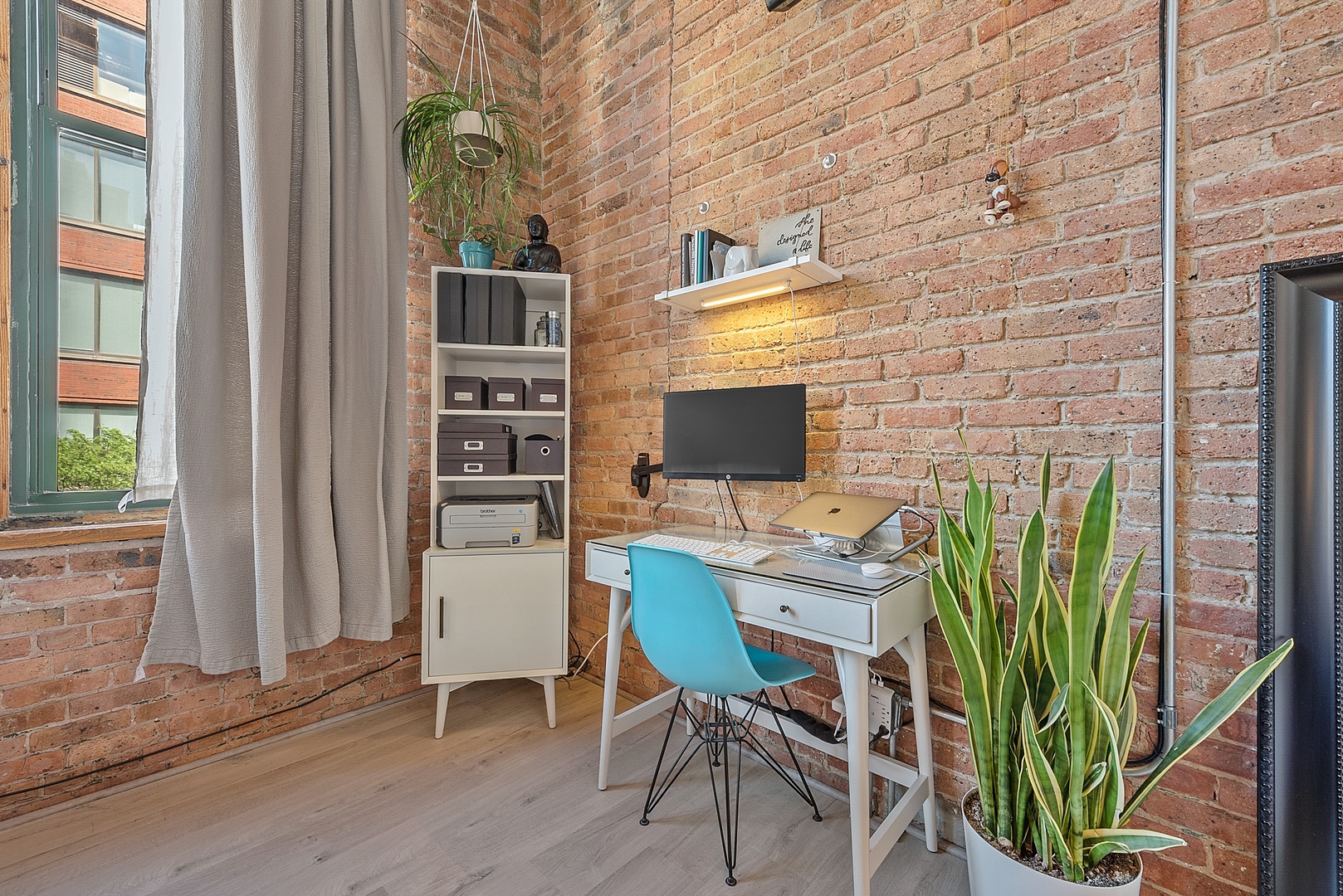 331 South Peoria Street, Unit 303 Chicago, IL 60607 - Photo 16 of 25 a work room with furniture and wooden floor