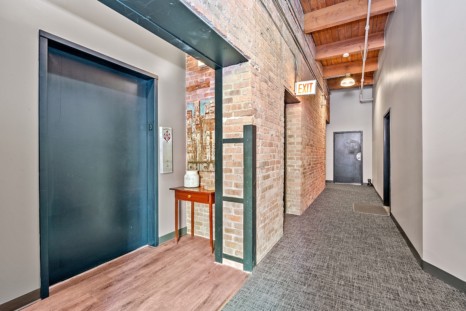 331 South Peoria Street, Unit 303 Chicago, IL 60607 - Photo 25 of 25 a view of a hallway with wooden floor and entryway