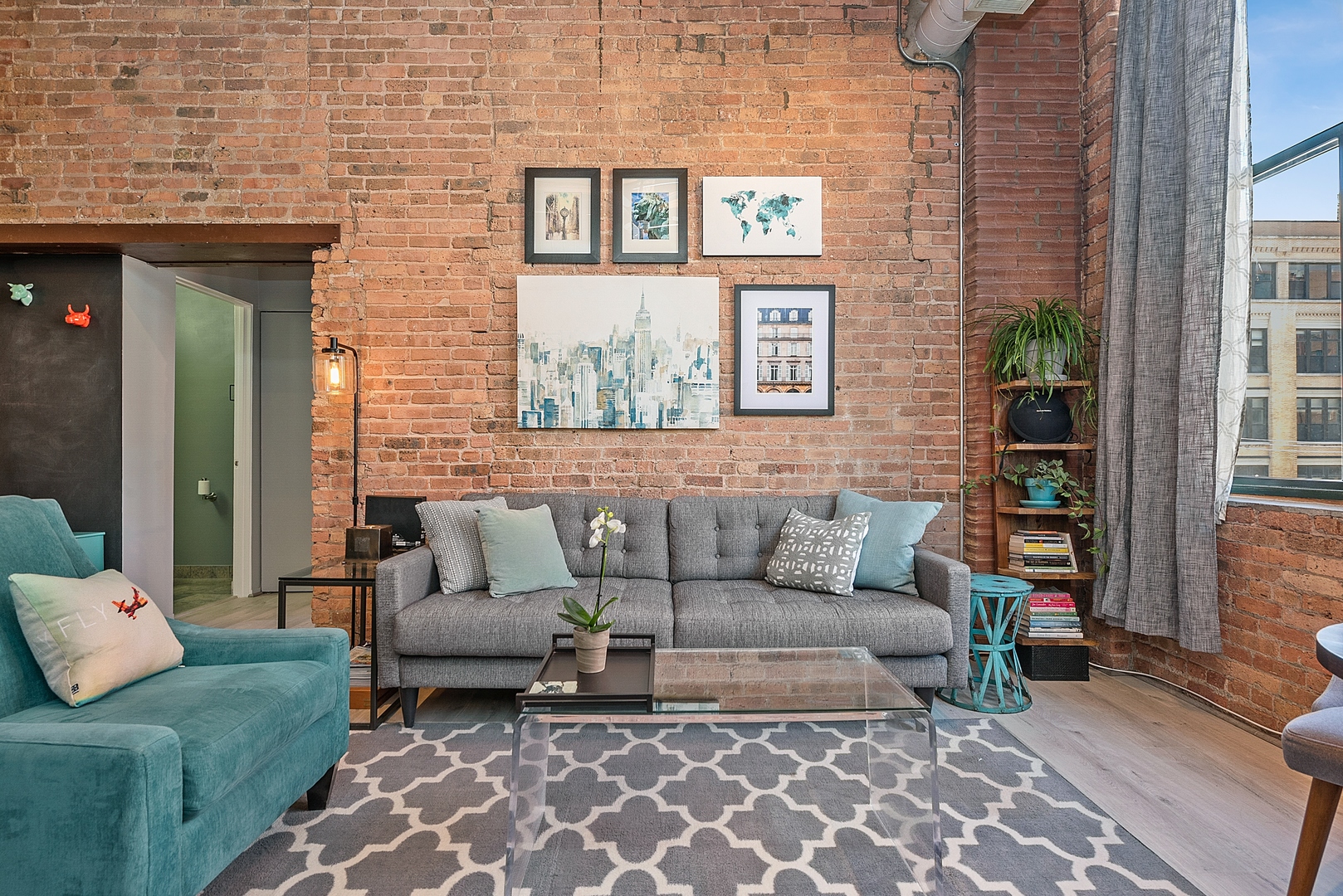 331 South Peoria Street, Unit 303 Chicago, IL 60607 - Photo 5 of 25 a view of a patio with couches and a potted plant