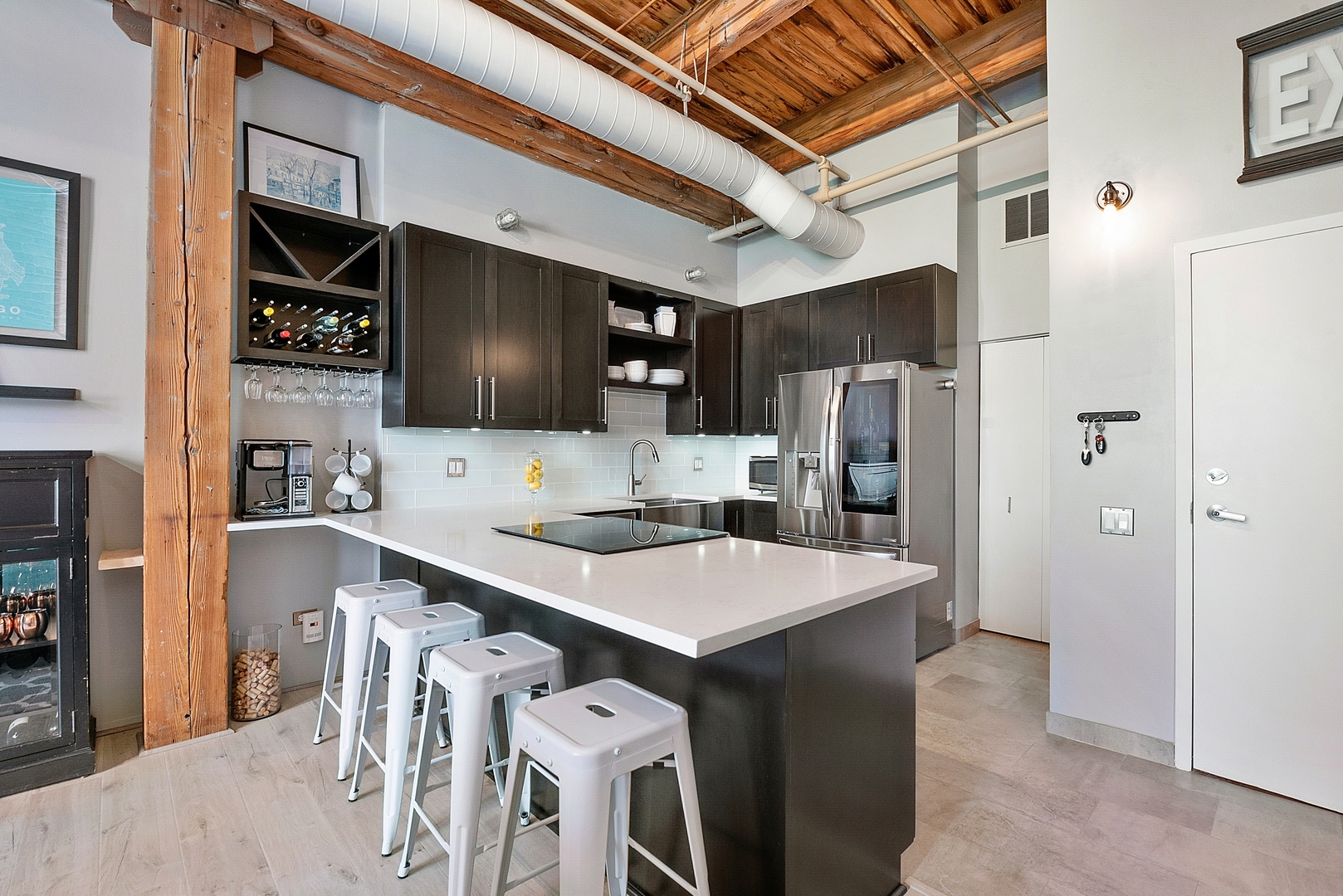 331 South Peoria Street, Unit 303 Chicago, IL 60607 - Photo 8 of 25 a kitchen with stainless steel appliances a refrigerator and a stove top oven