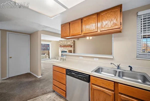 a kitchen with stainless steel appliances granite countertop a refrigerator a stove a sink and a refrigerator