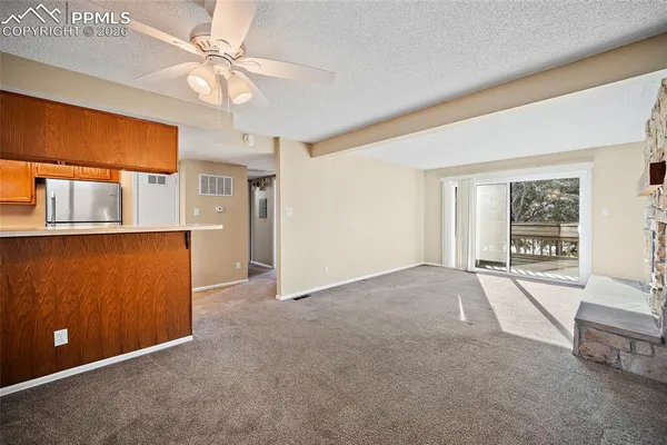 a living room with a couch and a fireplace