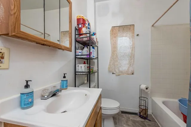 a bathroom with a sink a toilet and a bathtub