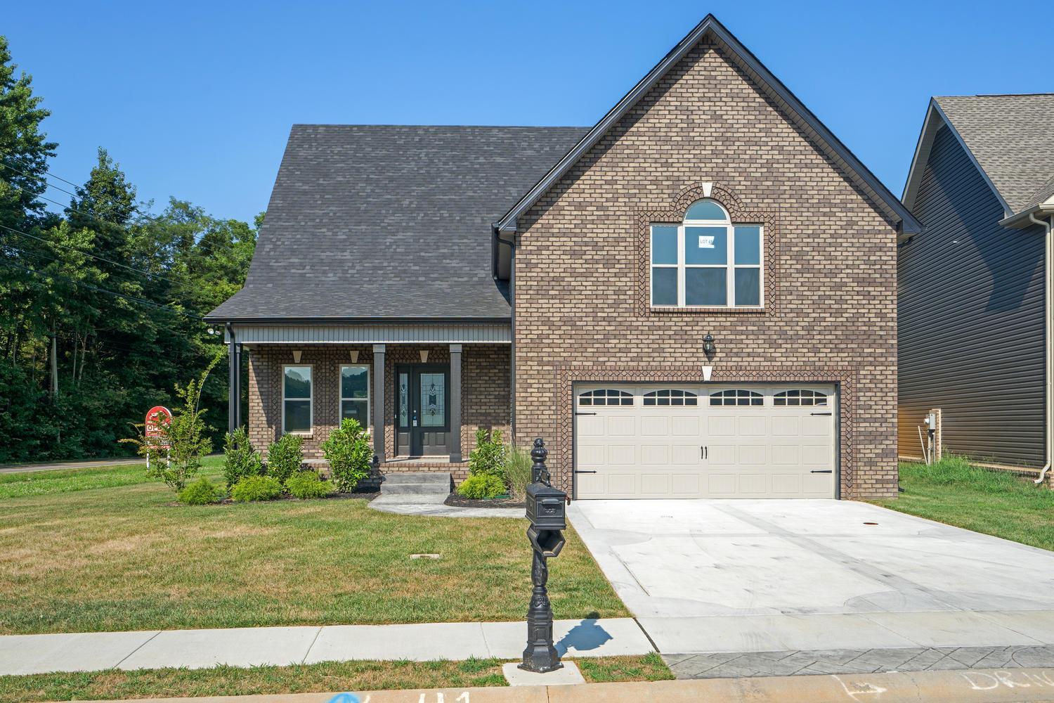 1003 Barnhill Road Clarksville, TN 37043 - Photo 1 of 5 a front view of a house with a yard