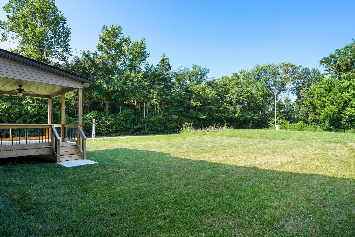 1003 Barnhill Road Clarksville, TN 37043 - Photo 5 of 5 a view of a house with a backyard