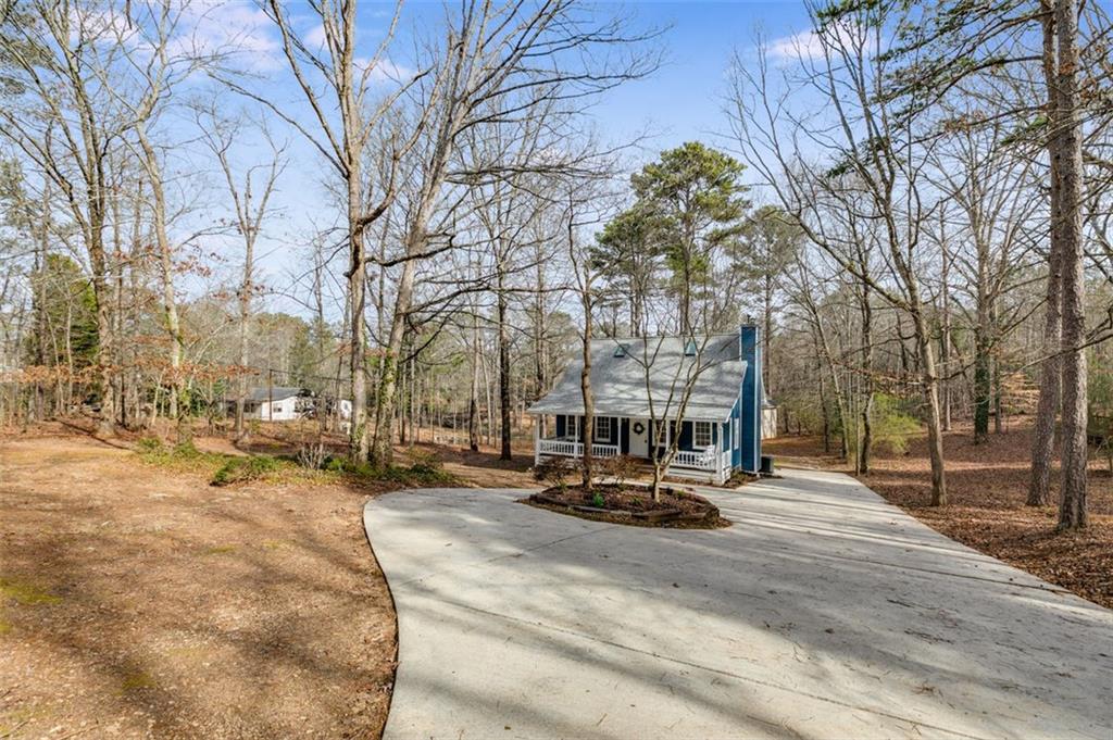 3500 Pope Road Douglasville, GA 30135 - Photo 1 of 1 a view of outdoor space with garden and trees
