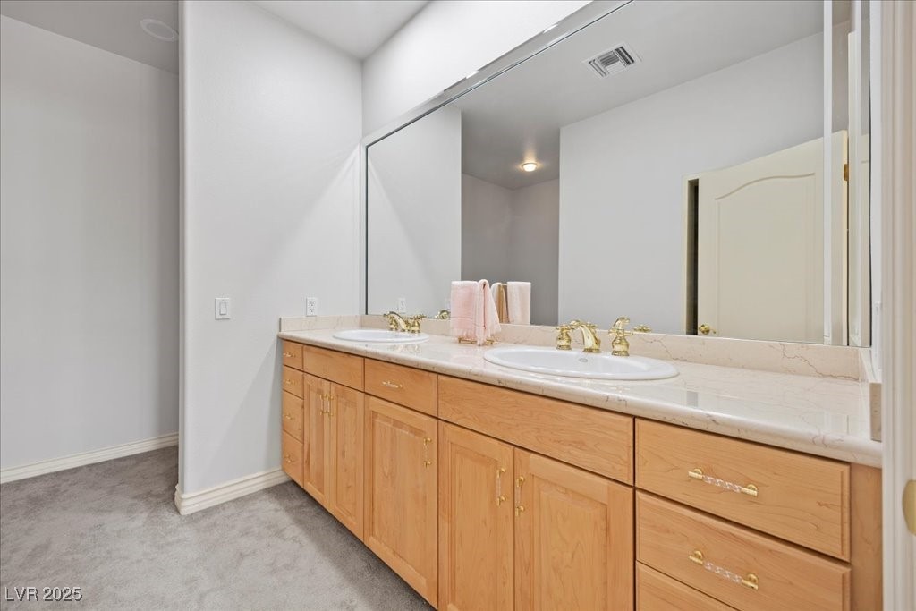 640 Quail Covey Road Henderson, NV 89002 - Photo 36 of 75 5th Bathroom featuring double vanity and baseboards
