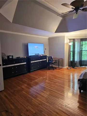a view of kitchen with furniture and wooden floor