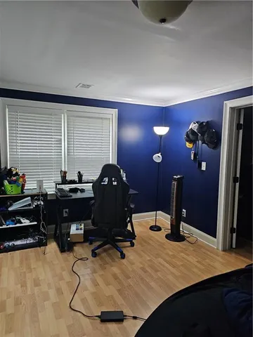 a room with gym equipment and a large window