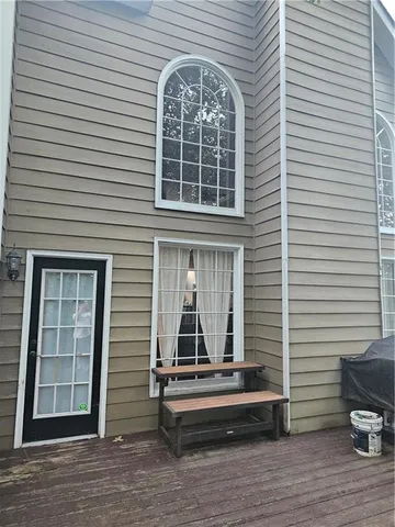 a view of a brick house with many windows