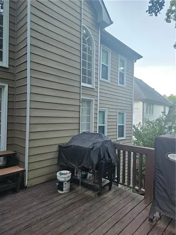 a view of a deck with furniture and wooden floor