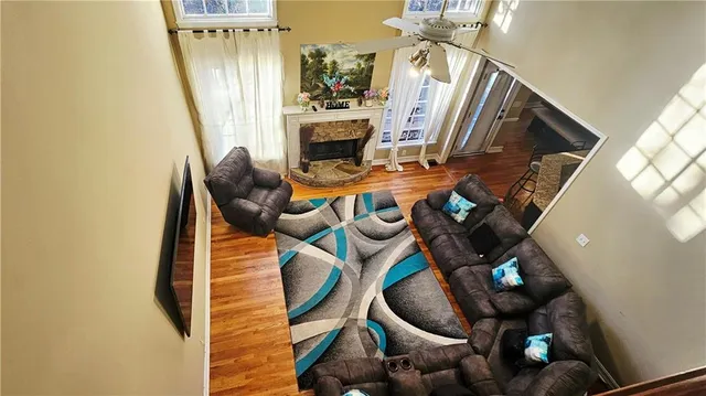 a living room with furniture and a fireplace