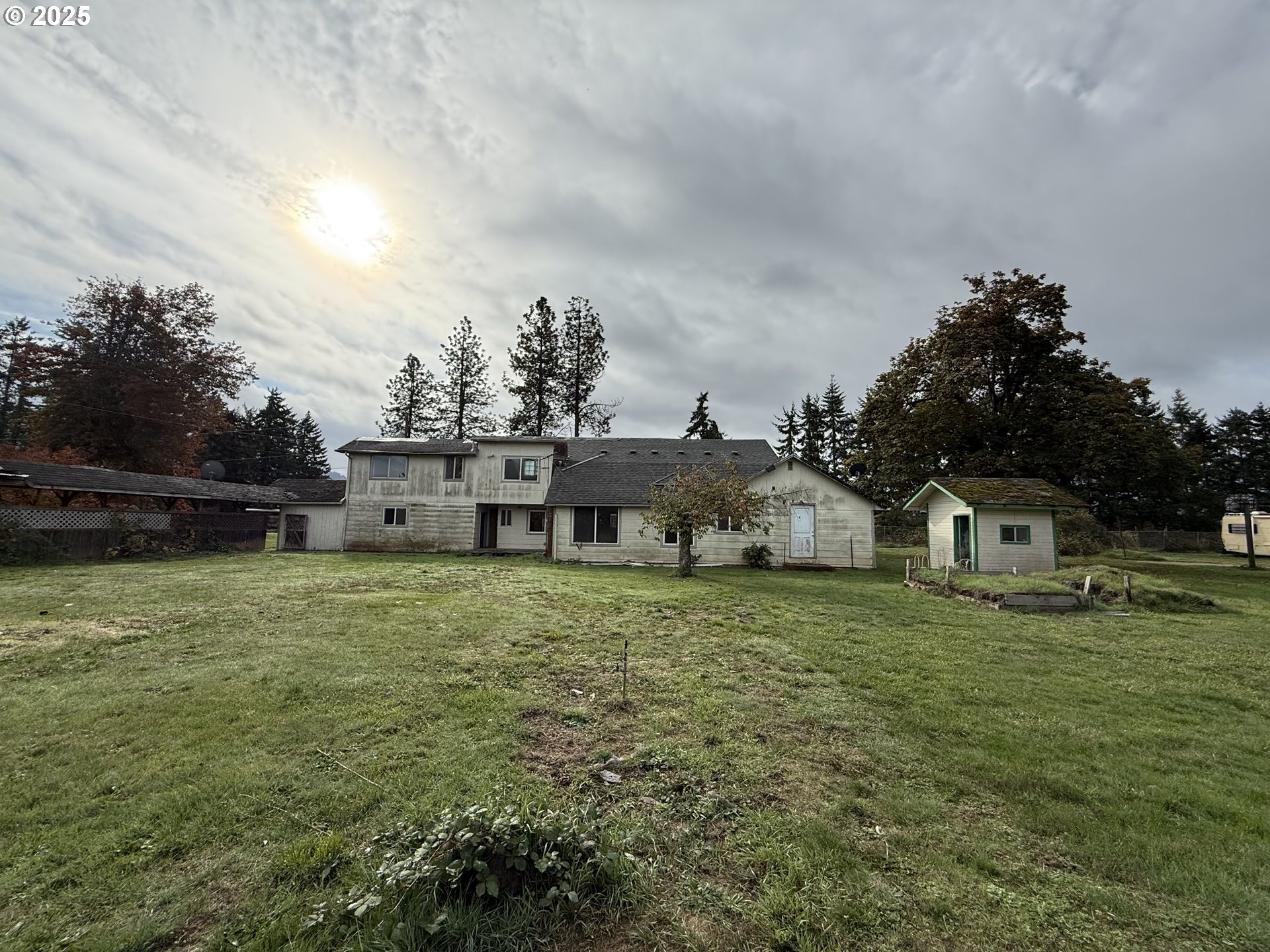 33425 Tate Road Creswell, OR 97426 - Photo 3 of 15 a front view of a house with a garden