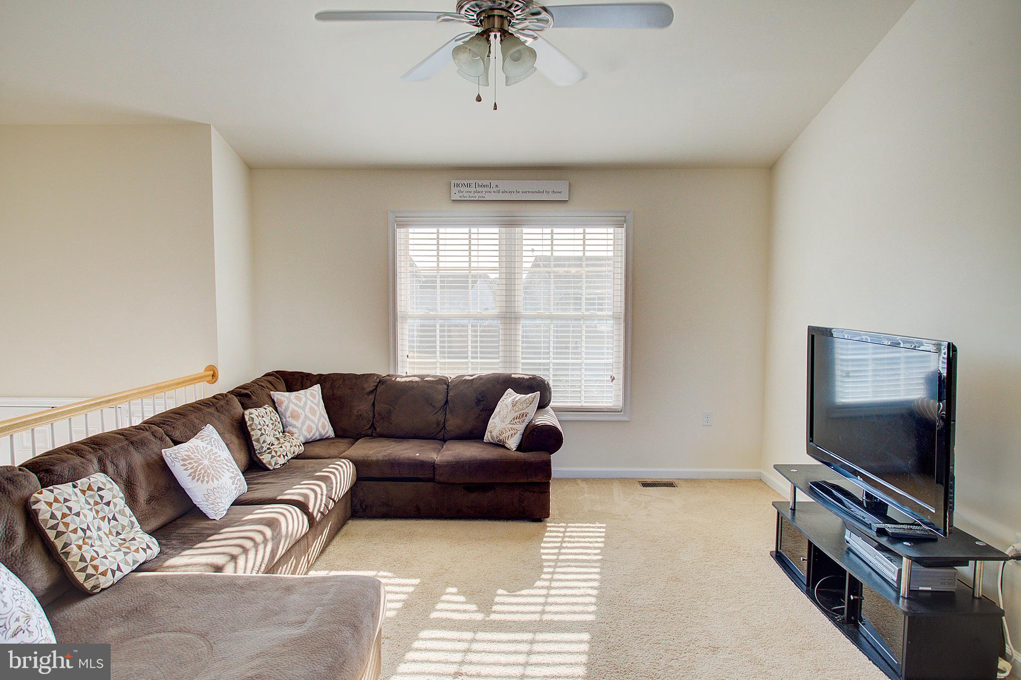 141 Buchanan Lane Inwood, WV 25428 - Photo 14 of 32 Living room has exceptional light.