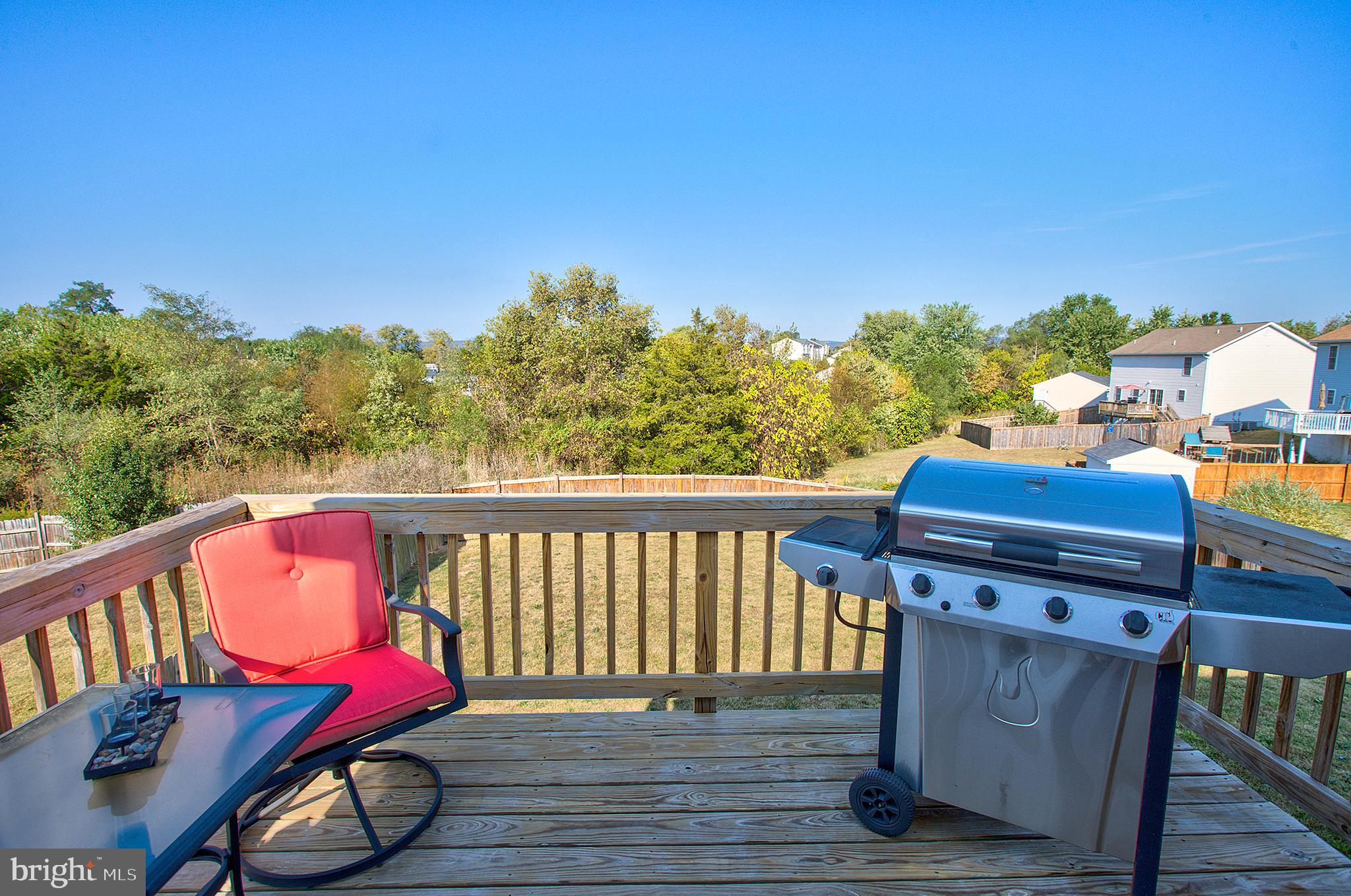 141 Buchanan Lane Inwood, WV 25428 - Photo 27 of 32 It's grill time on your very own deck.