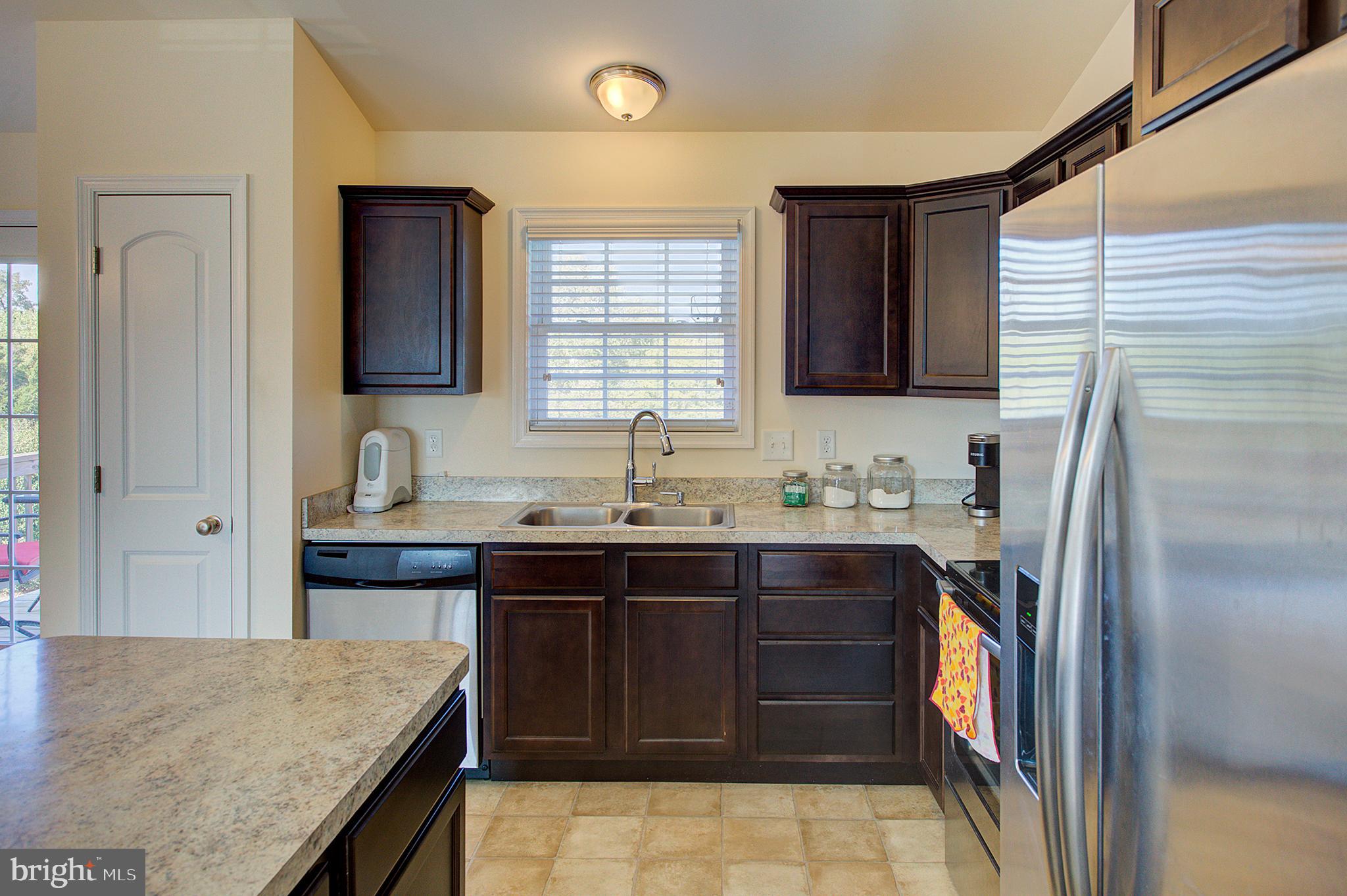 141 Buchanan Lane Inwood, WV 25428 - Photo 7 of 32 Great flow & Easy maintenance kitchen.