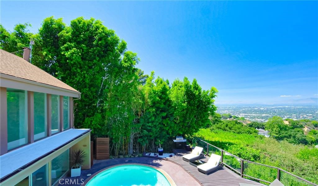 13425 Java Drive Beverly Hills, CA 90210 - Photo 12 of 28 a view of a backyard with couches plants and large trees