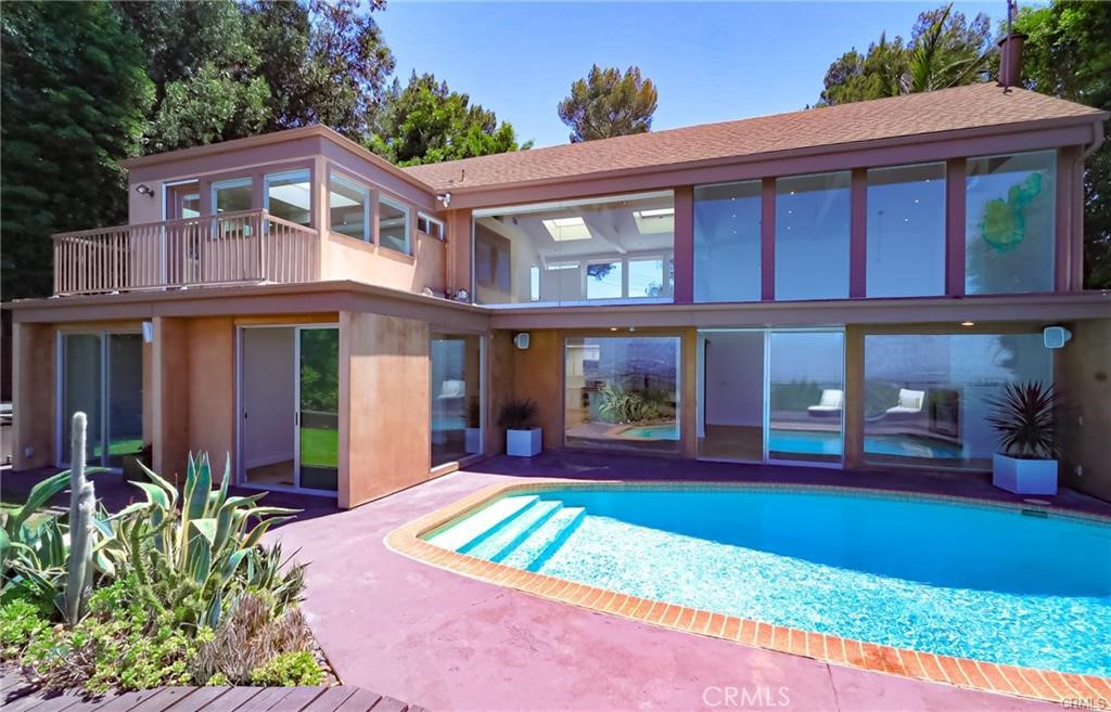 13425 Java Drive Beverly Hills, CA 90210 - Photo 13 of 28 front view of a brick house with a yard