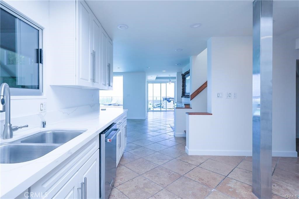 13425 Java Drive Beverly Hills, CA 90210 - Photo 24 of 28 a kitchen with a sink and cabinets