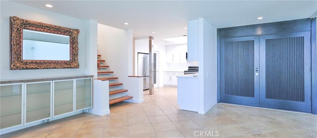 13425 Java Drive Beverly Hills, CA 90210 - Photo 27 of 28 a view of a hallway with cabinet and mirrors