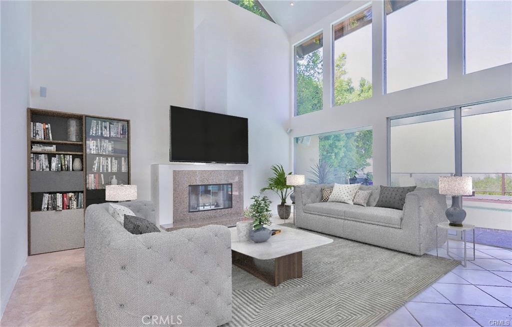 13425 Java Drive Beverly Hills, CA 90210 - Photo 5 of 28 a living room with furniture a fireplace and a flat screen tv