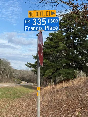 a sign that is on the side of a road