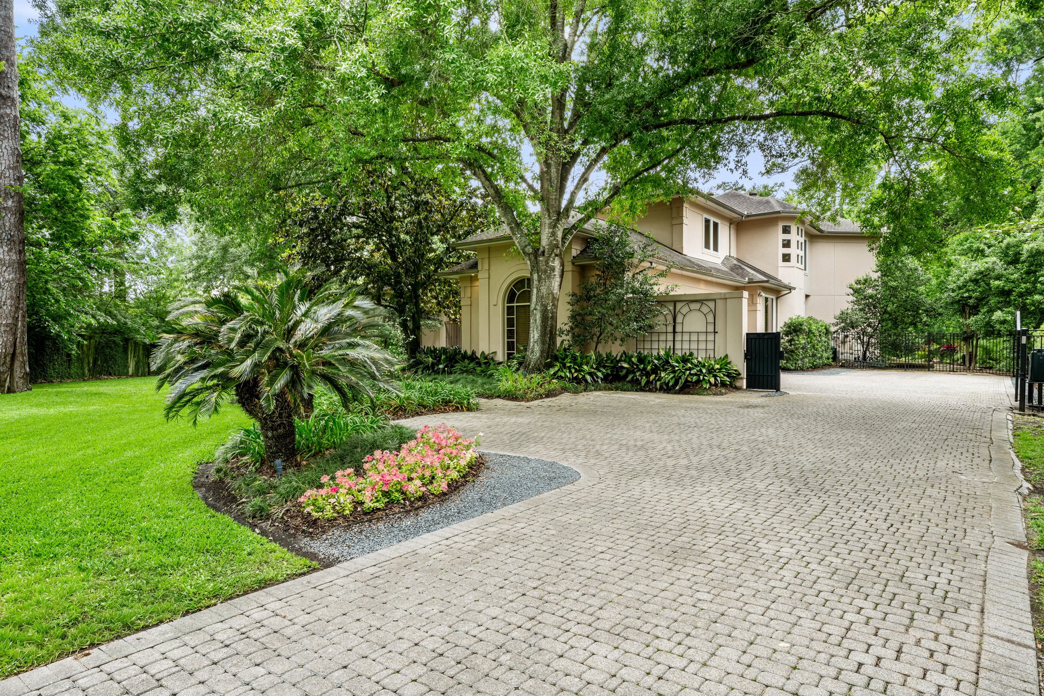 6 Mott Lane Houston, TX 77024 - Photo 7 of 50 Stately paver driveway welcomes you creating a grand yet private approach.