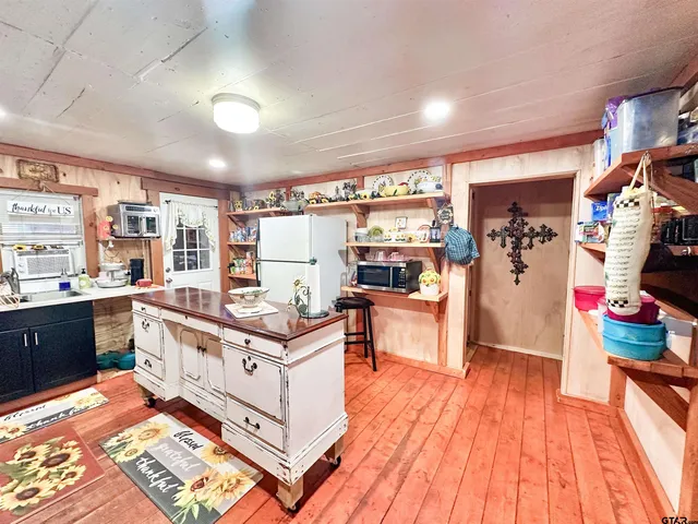 a kitchen with stainless steel appliances granite countertop a stove and a refrigerator