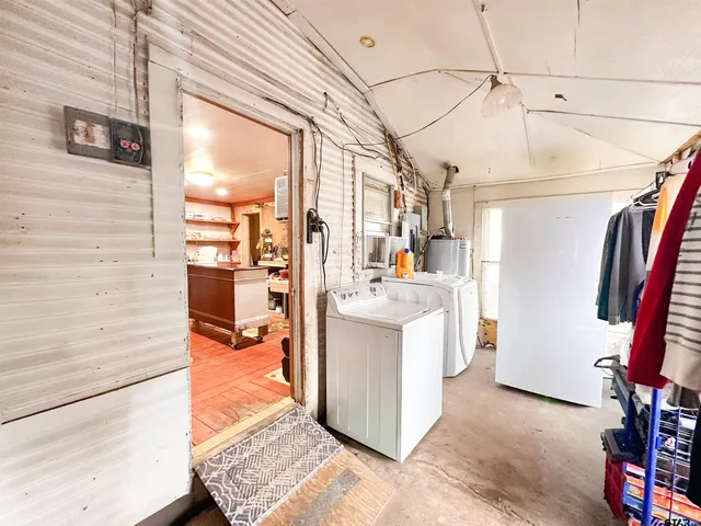 a bedroom with furniture and a wooden floor