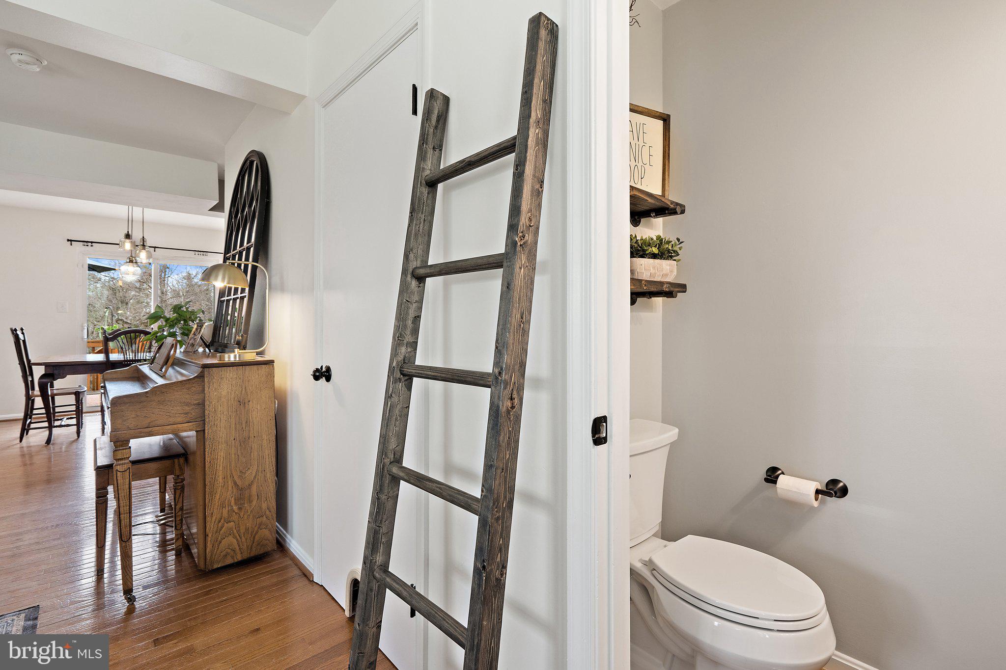 14801 Rising Sun Lane Haymarket, VA 20169 - Photo 16 of 39 Half bath on the main level and stairs to basement