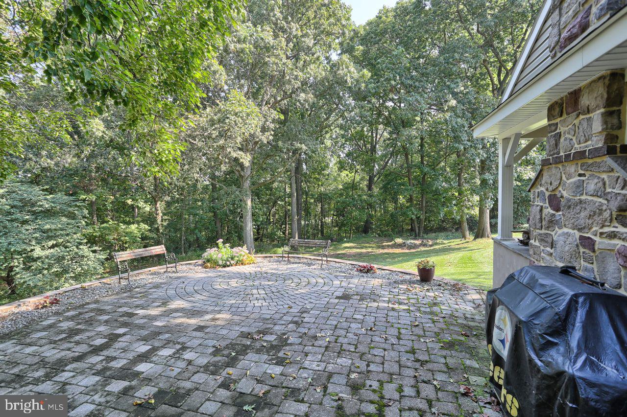 190 Hossler Road Manheim, PA 17545 - Photo 36 of 39 Expansive paver patio overlooks the woods.