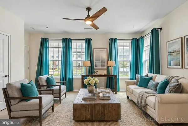 a living room with furniture and a large window