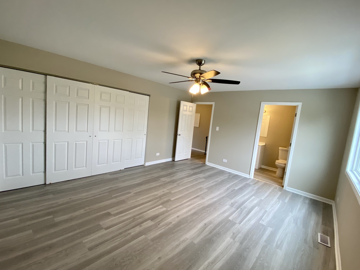 231 Oakhurst Road Matteson, IL 60443 - Photo 6 of 8 a view of an empty room with wooden floor