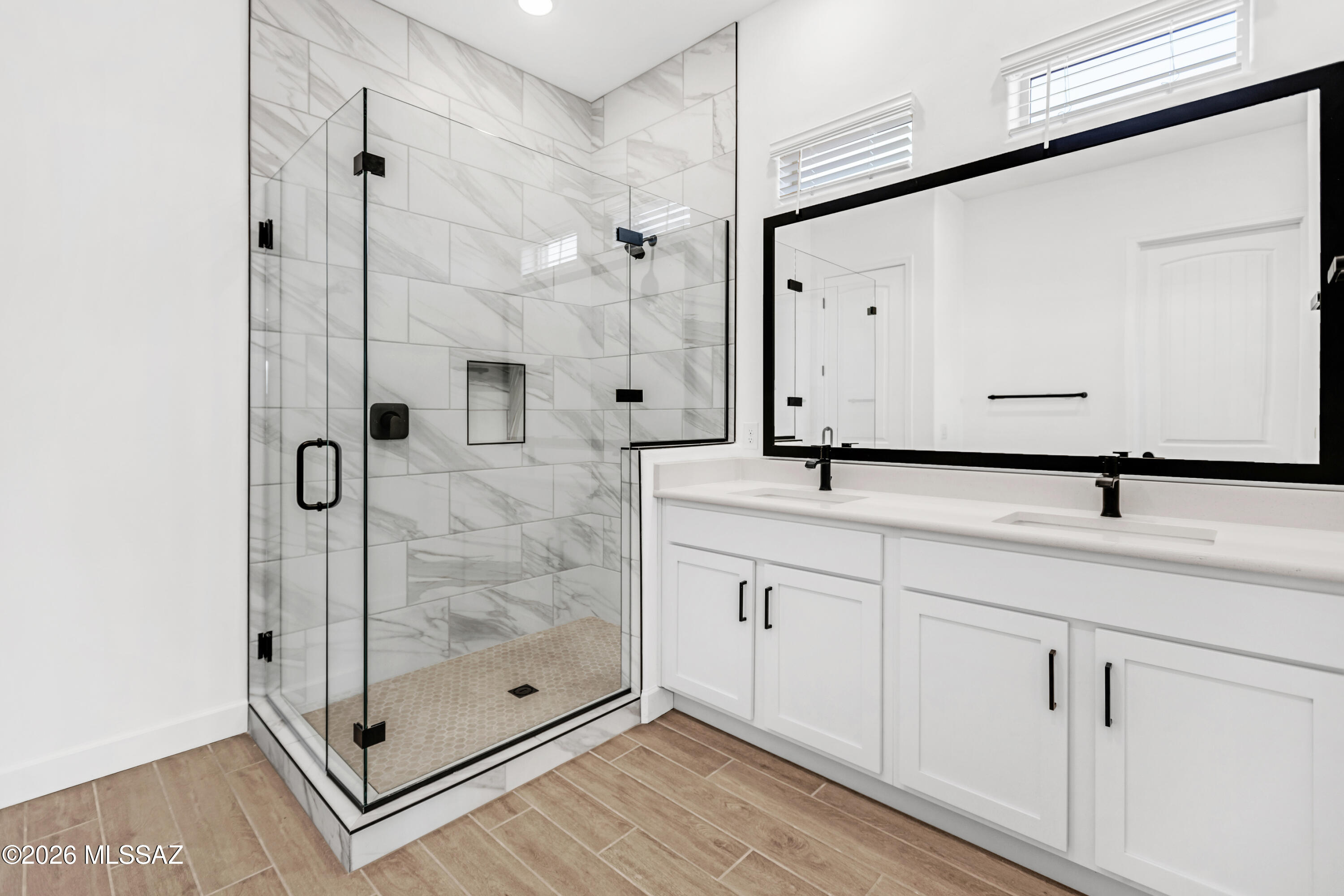 14736 East Sands Ranch Road Vail, AZ 85641 - Photo 16 of 20 a bathroom with a shower sink and mirror