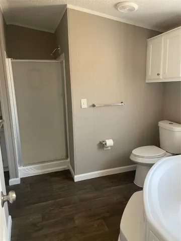 a white toilet sitting next to a bathroom sink