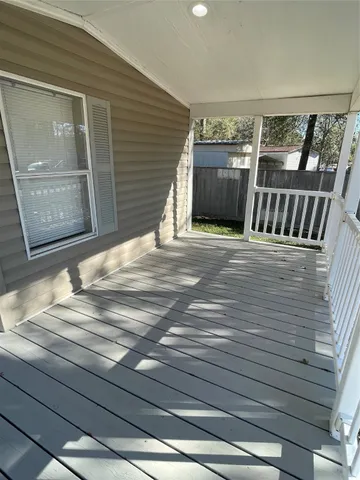 a view of a door and wooden floor