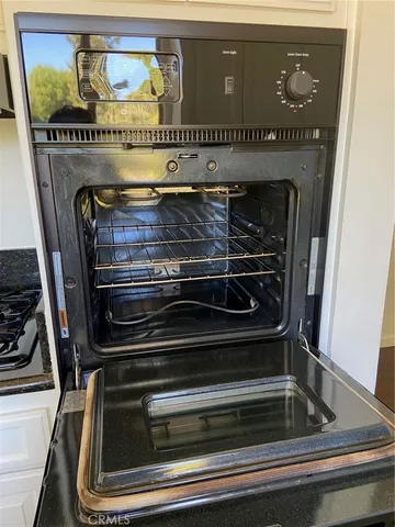 a view of room with window and wooden floor