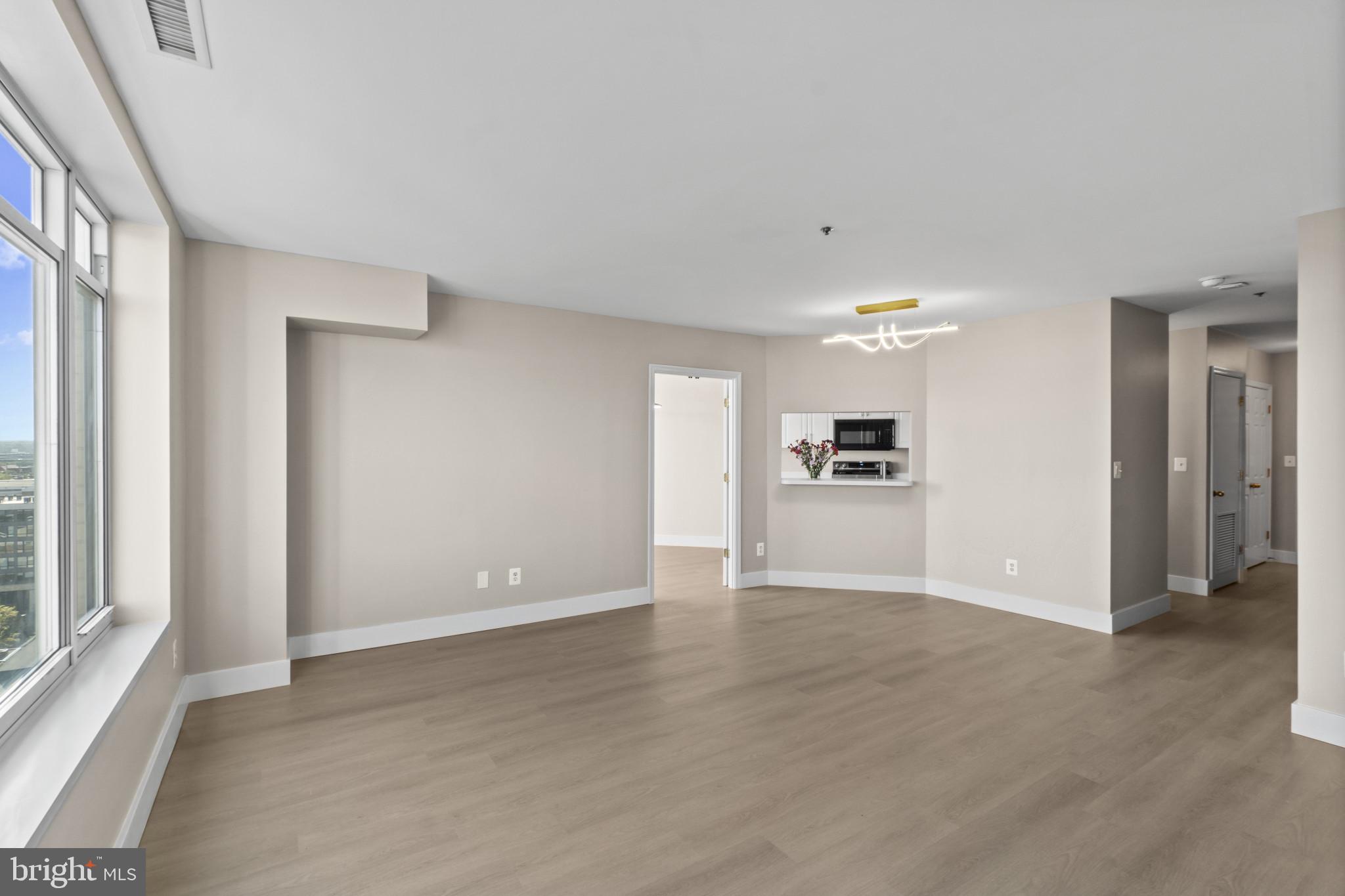 100 Harborview Drive, Unit 1312 Baltimore, MD 21230 - Photo 11 of 37 a view of an empty room with a window