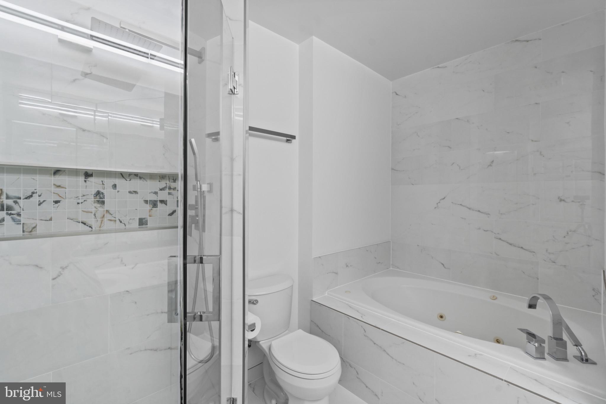 100 Harborview Drive, Unit 1312 Baltimore, MD 21230 - Photo 29 of 37 a bathroom with a bathtub and a shower