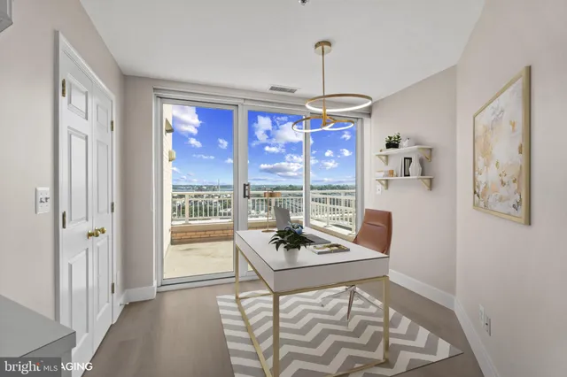 a bathroom with a granite countertop toilet sink and mirror
