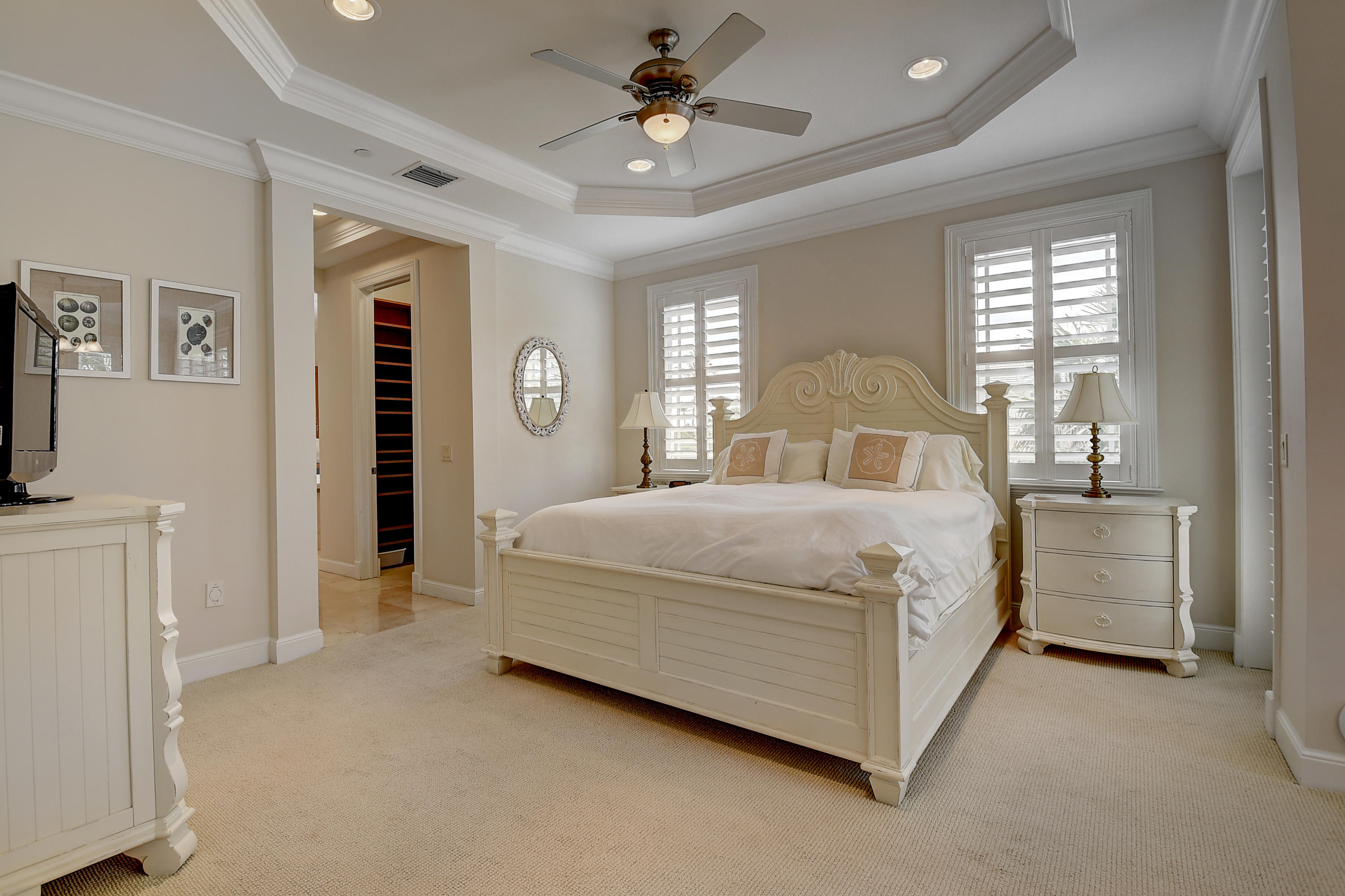 1120 Ocean Terrace Delray Beach, FL 33483 - Photo 25 of 47 a bedroom with a bed and a chandelier