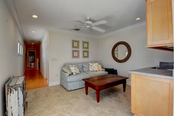a living room with furniture and a clock