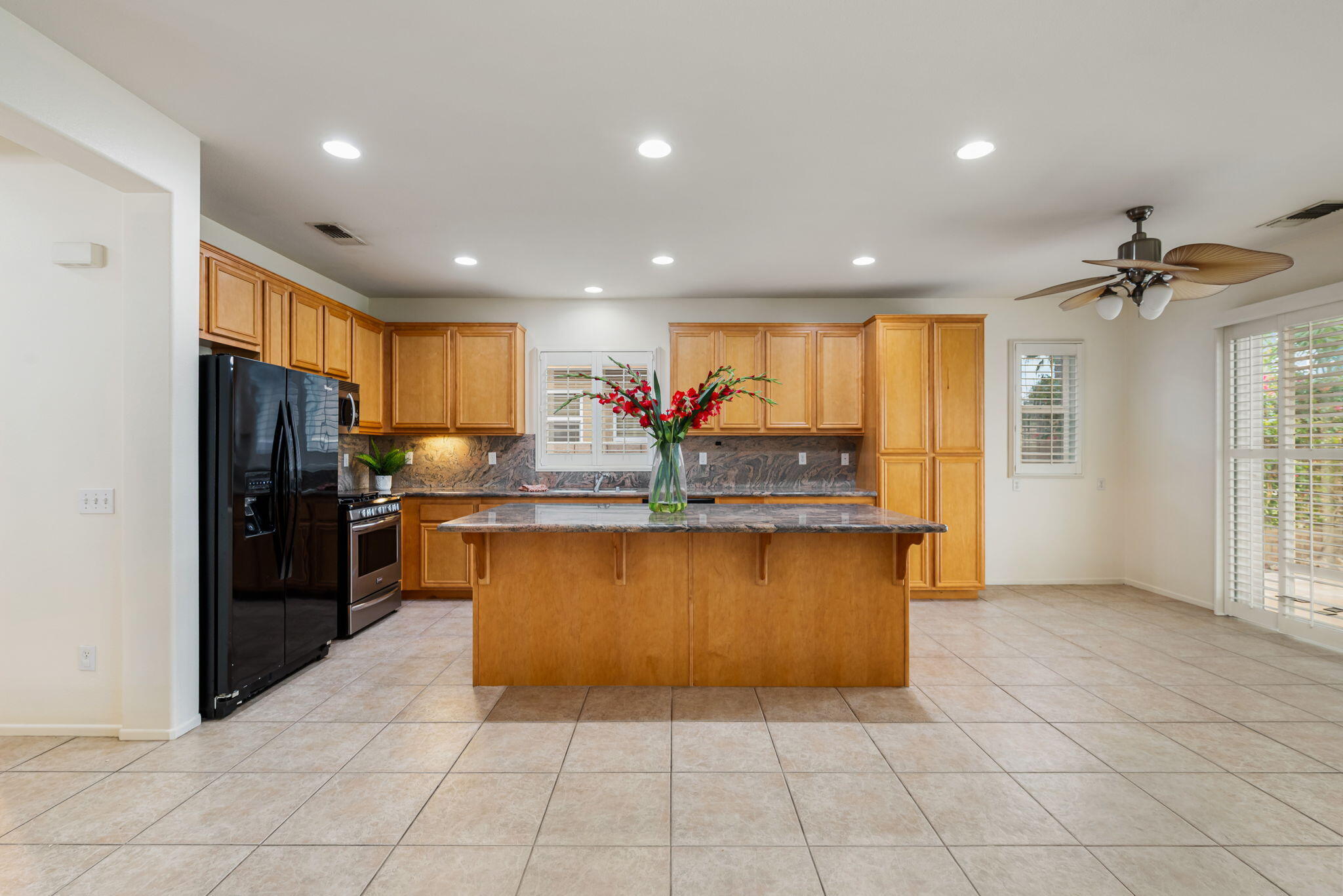 82631 Redford Way Indio, CA 92201 - Photo 21 of 43 a kitchen with stainless steel appliances a refrigerator sink and cabinets