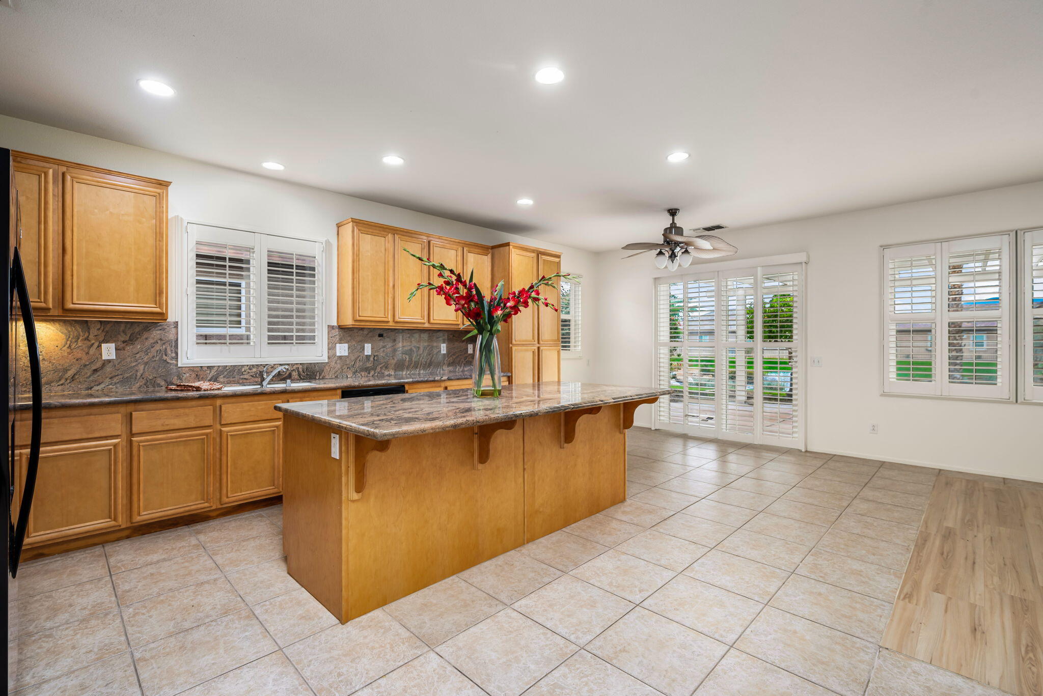 82631 Redford Way Indio, CA 92201 - Photo 22 of 43 a kitchen with stainless steel appliances granite countertop a sink and a stove