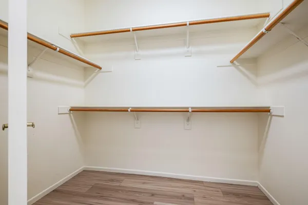 a view of an empty walk in closet