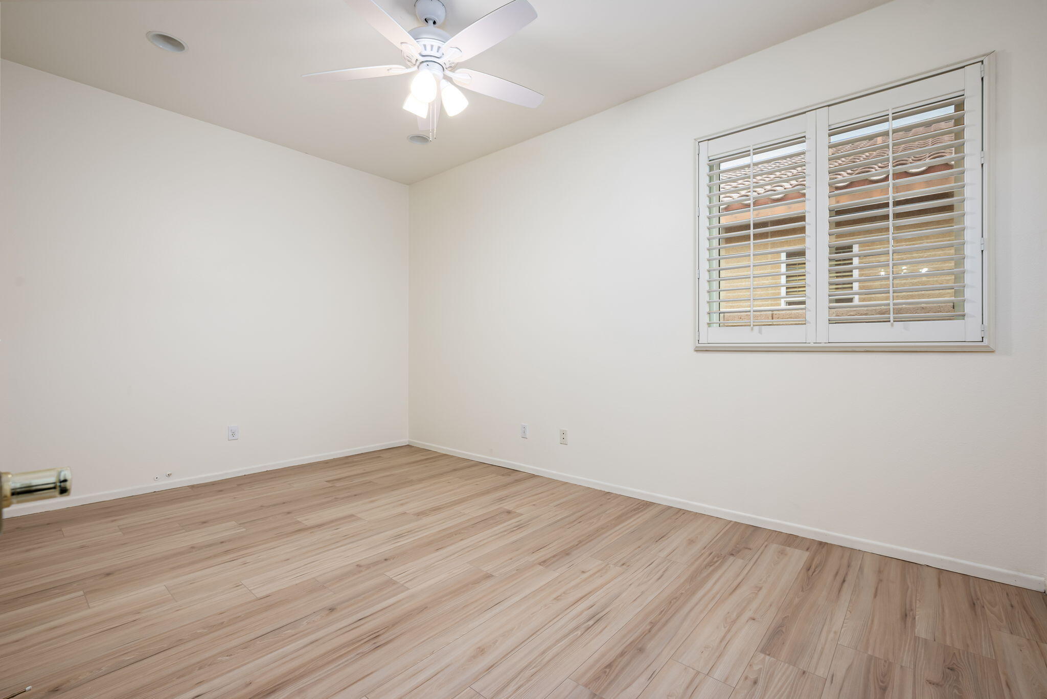 82631 Redford Way Indio, CA 92201 - Photo 30 of 43 a view of an empty room with wooden floor and a window
