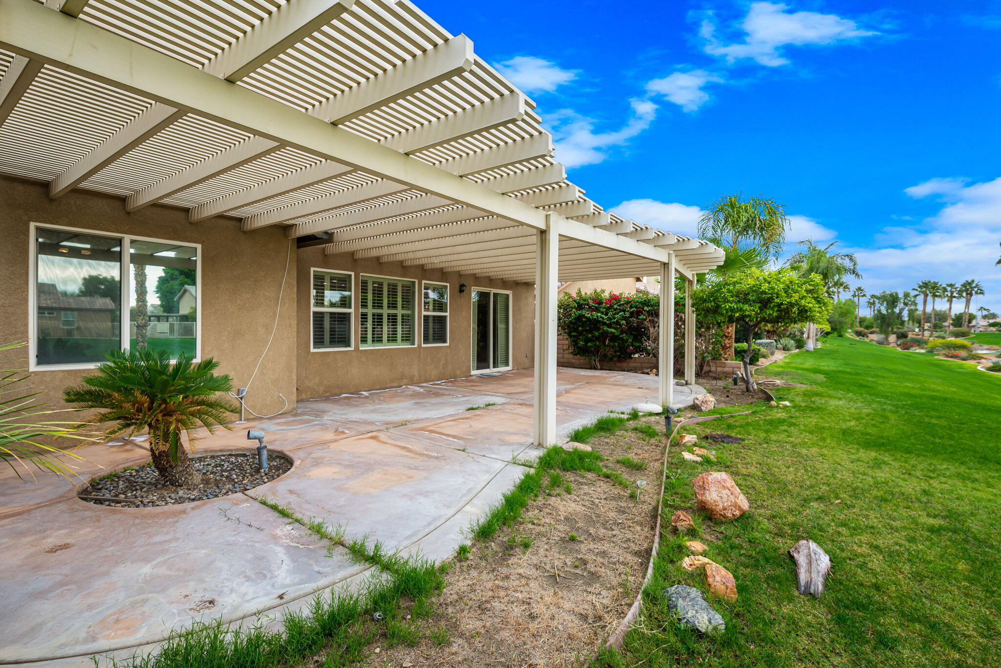 82631 Redford Way Indio, CA 92201 - Photo 42 of 43 a front view of a house with a yard