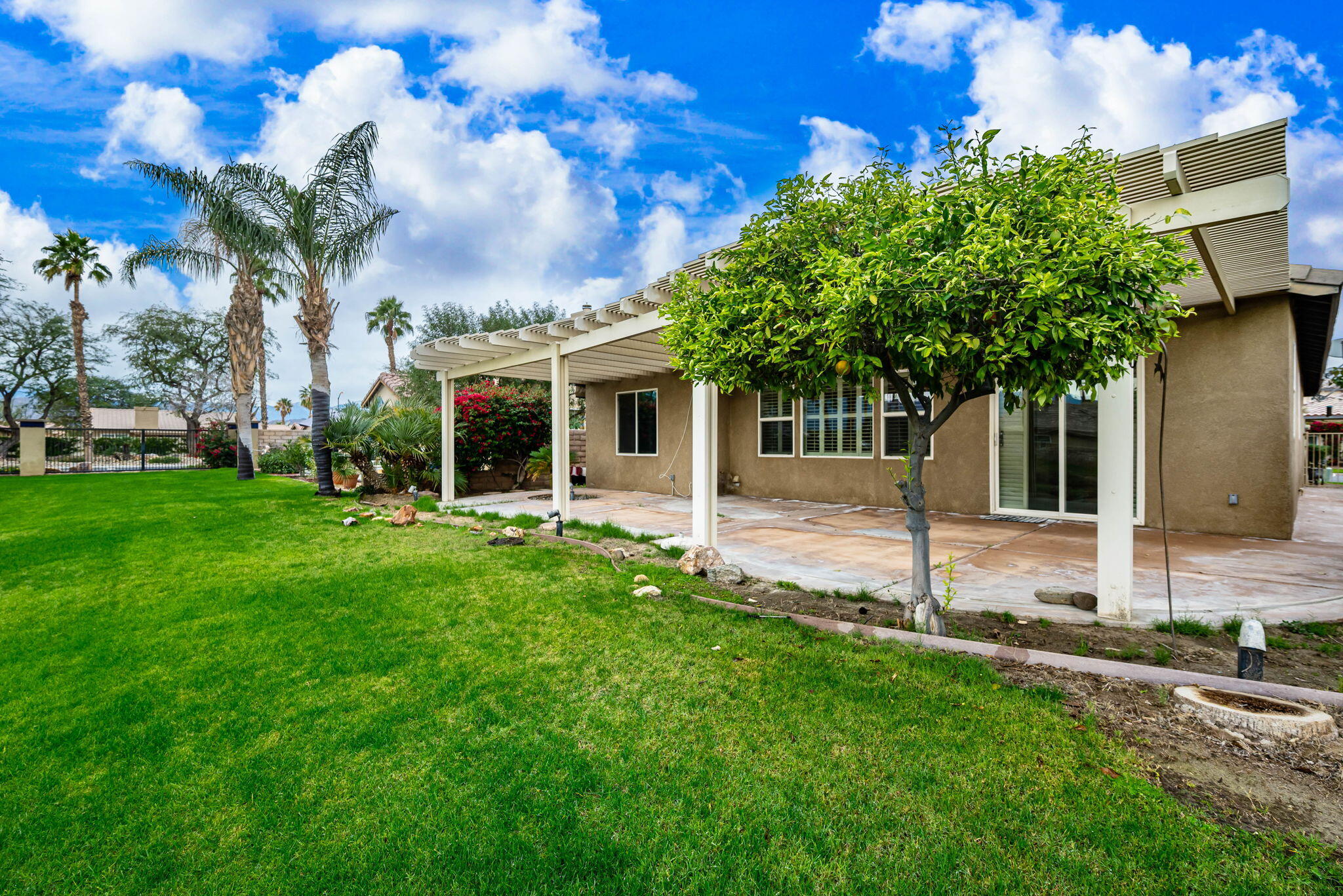 82631 Redford Way Indio, CA 92201 - Photo 43 of 43 a front view of a house with garden