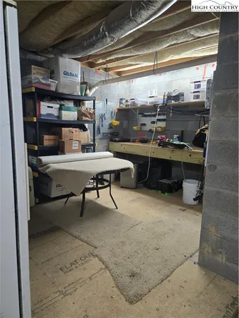 a view of a balcony with chairs and wooden floor