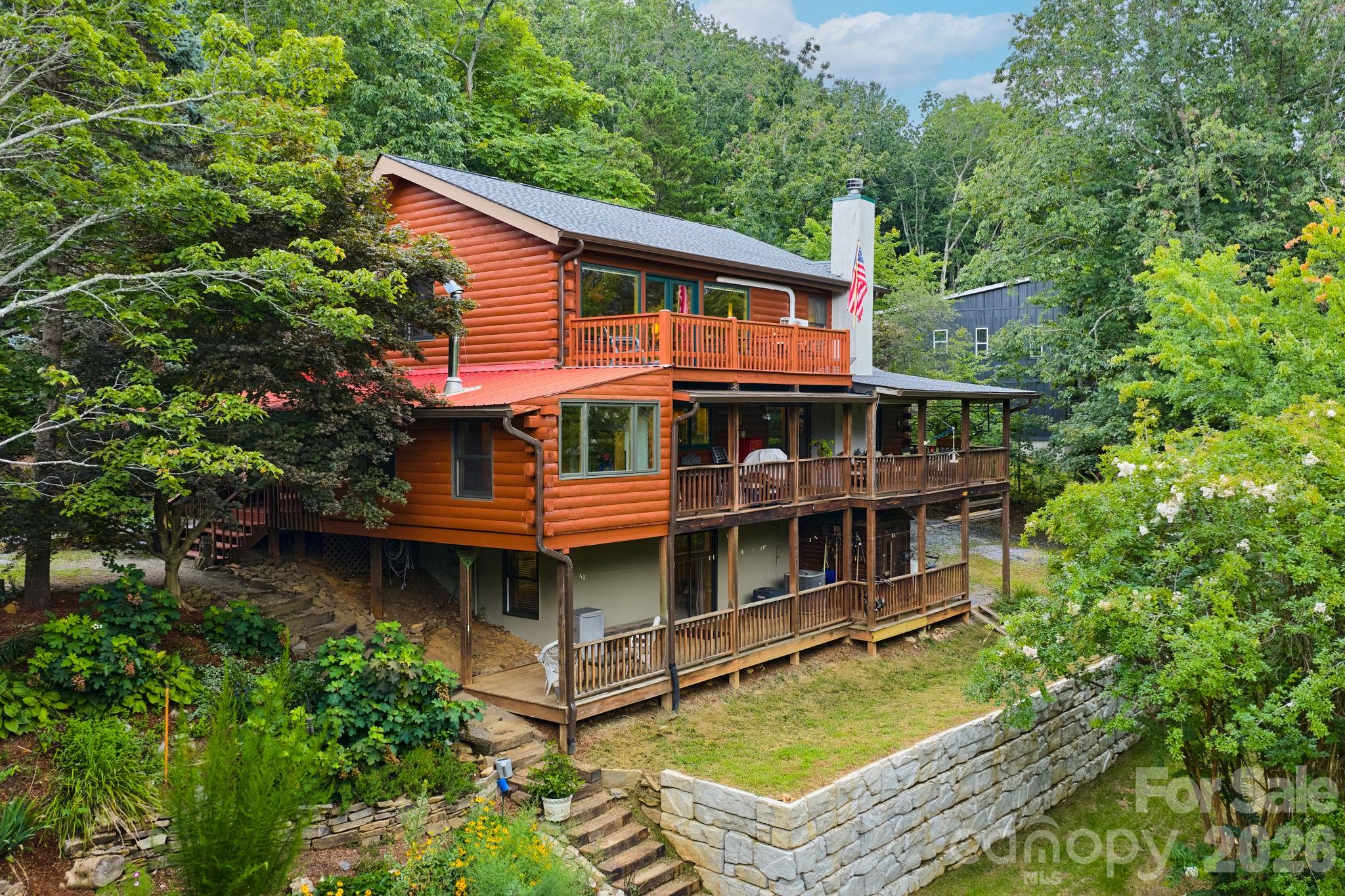 150 Avondale Ridge Road Asheville, NC 28803 - Photo 2 of 45 aerial view of a house with swimming pool and next to a yard